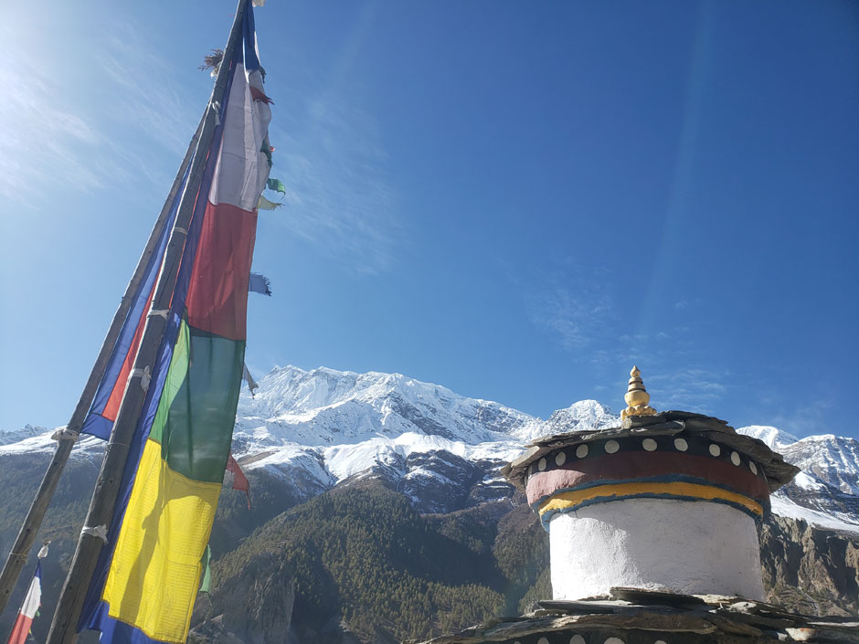 a mountain monastery and flag 