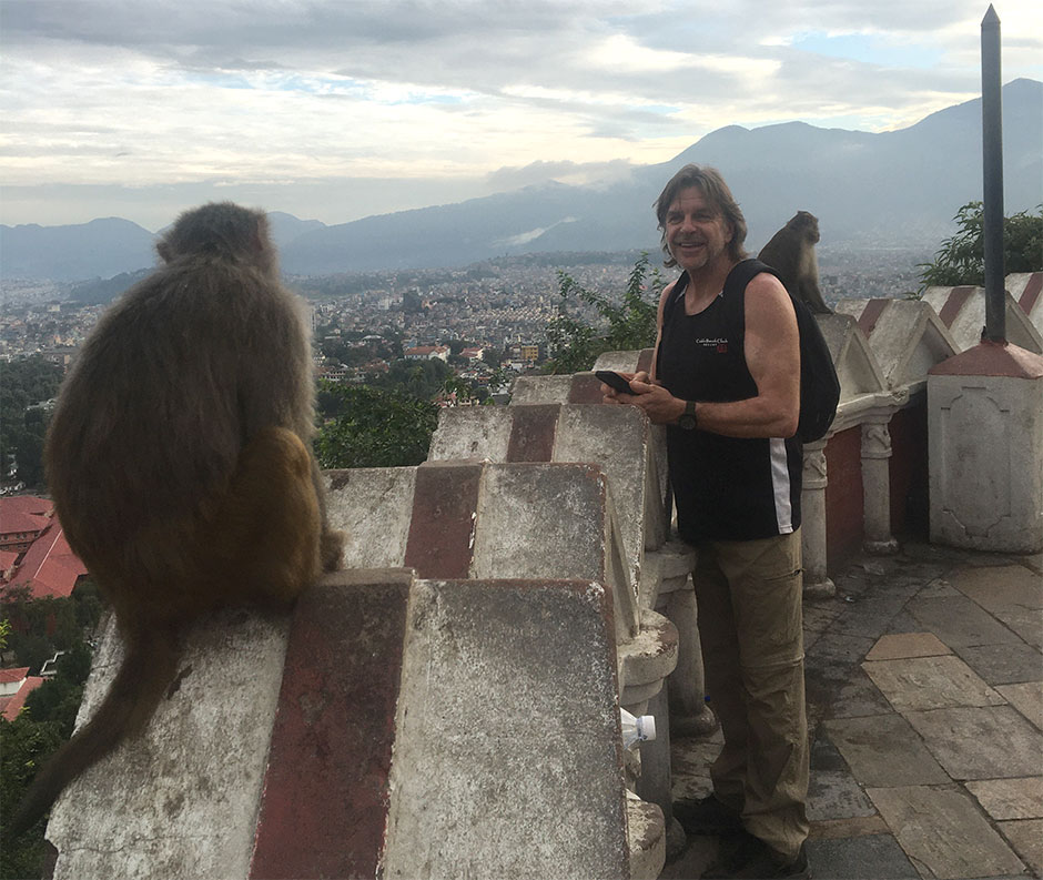 david looking at monkeys in a buddhist temple