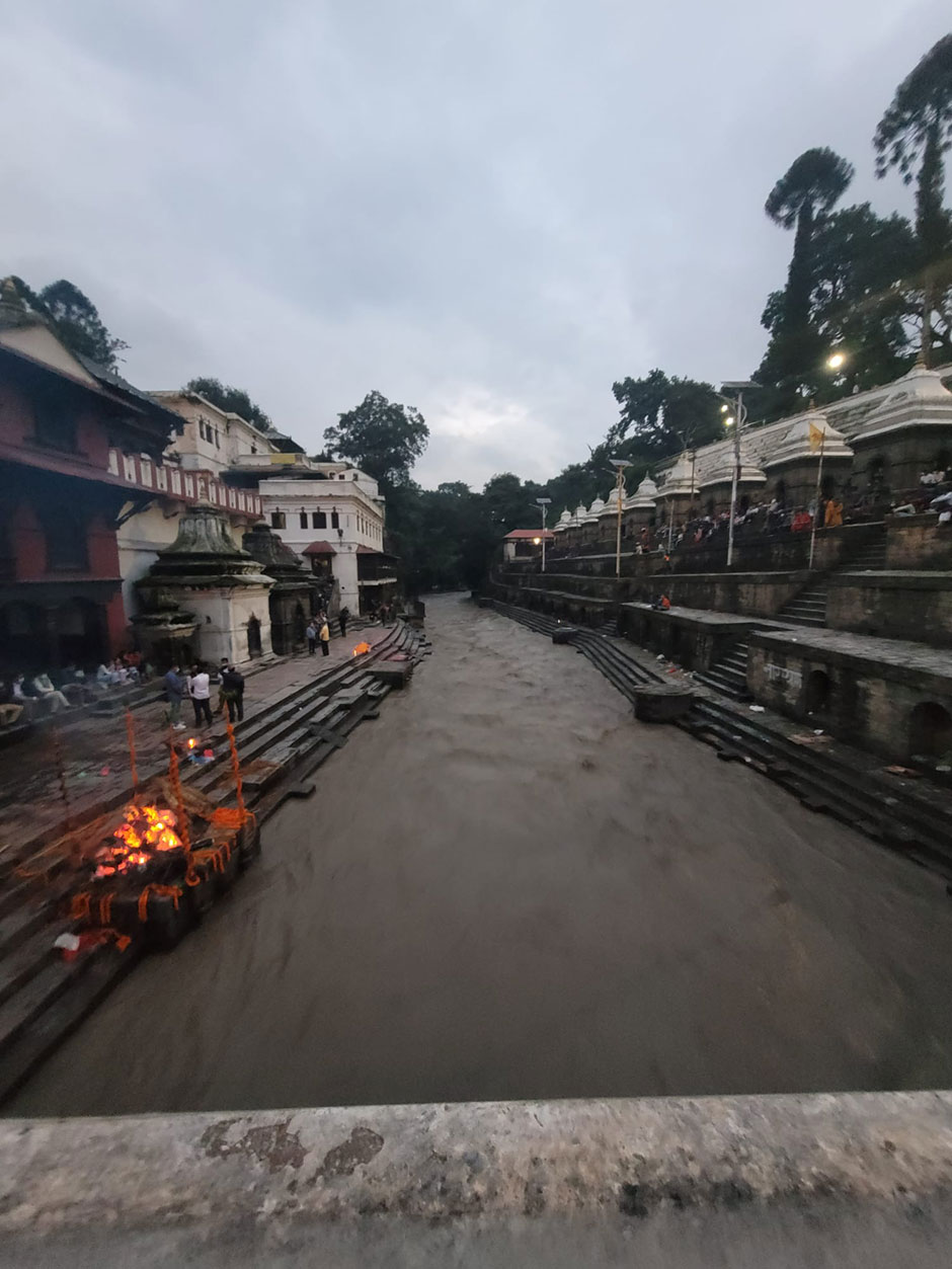 holy pashupati river with cremation in bank 