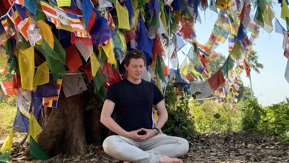 A practitioner meditating in birth place of buddha 