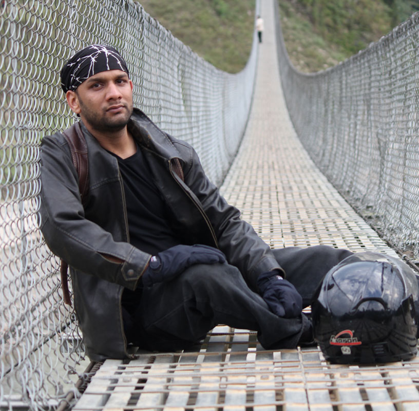 narayan mourya on a suspension bridge over trishuli river