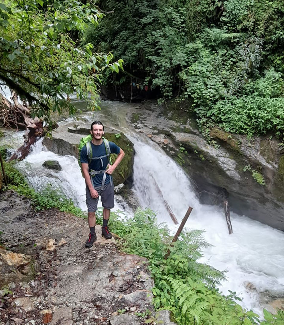 paul after crossing a stream on annapurna trail  